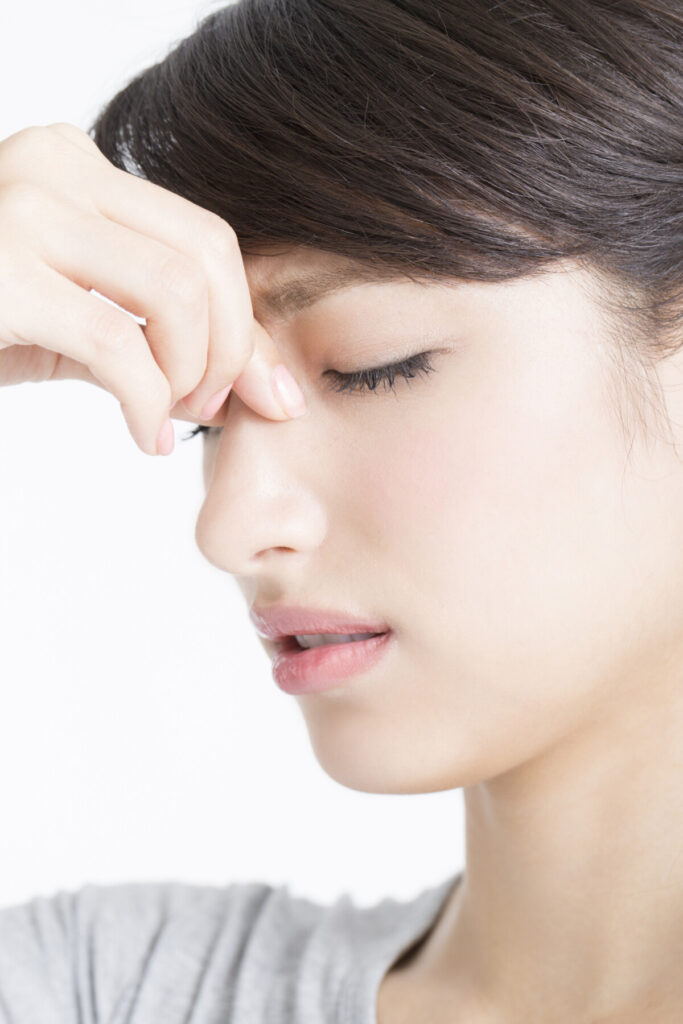 a woman suffering from breathing difficulty because of deviated nasal septum
